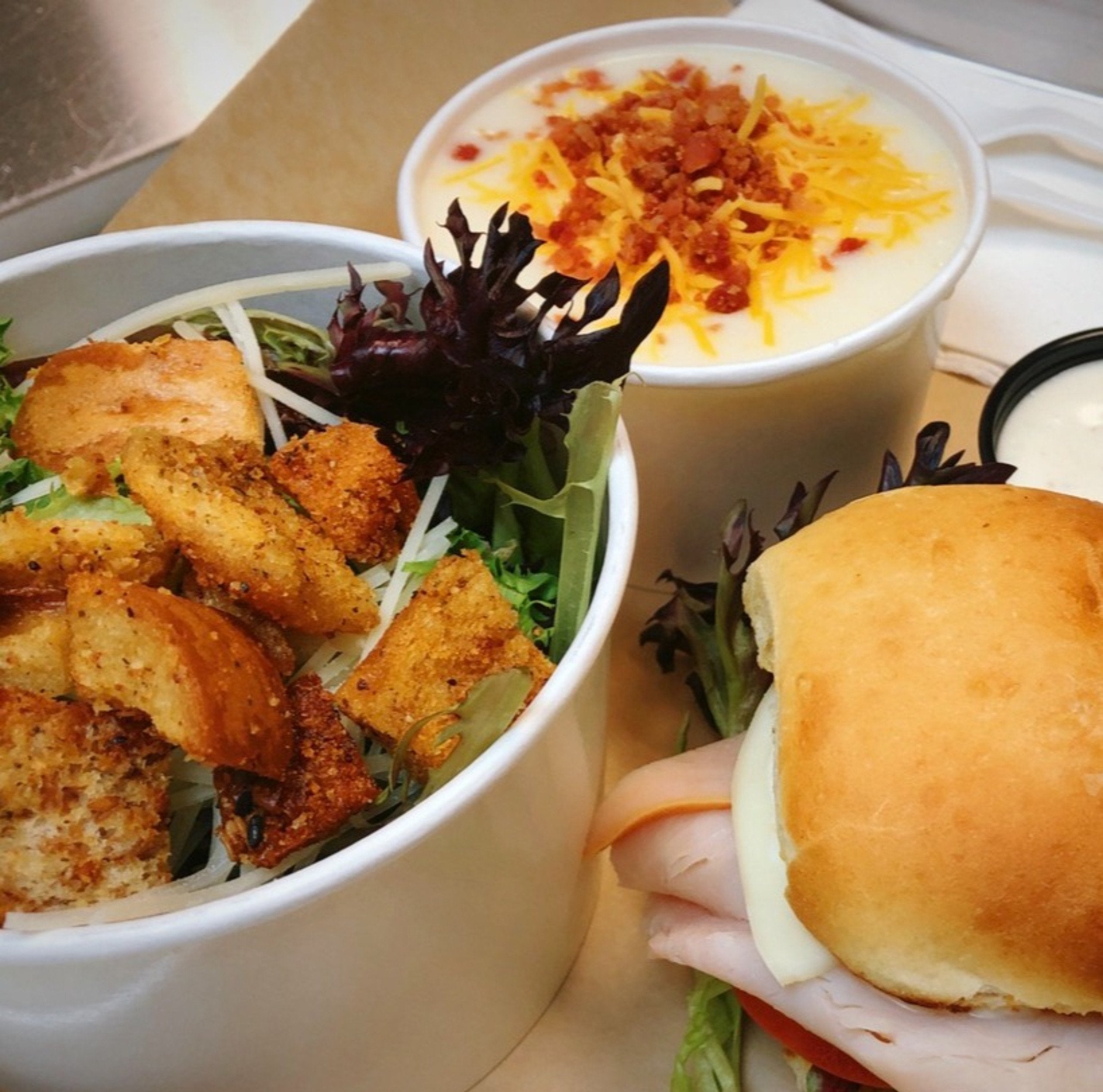 Slider sandwich, potato soup and Caesar salad